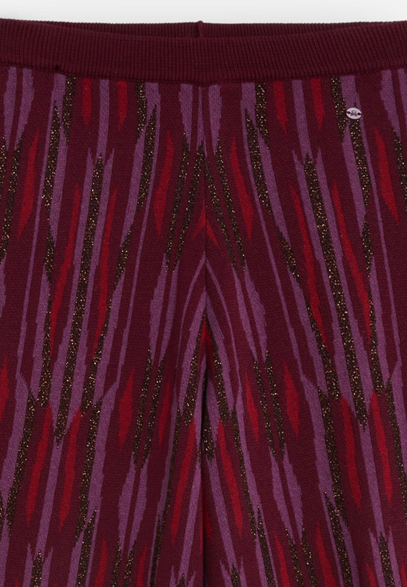 Scalpers CIRCLE Pantalones multicolor/rojo