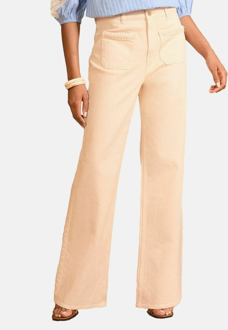 Lichtbeige wijde jeans van katoen, met een hoge taille, gevlochten accenten op de zakken en een gladde textuur.