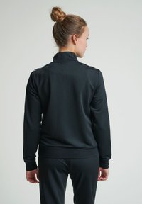 Hummel NELLY ZIP JACKET - Träningsjacka - black