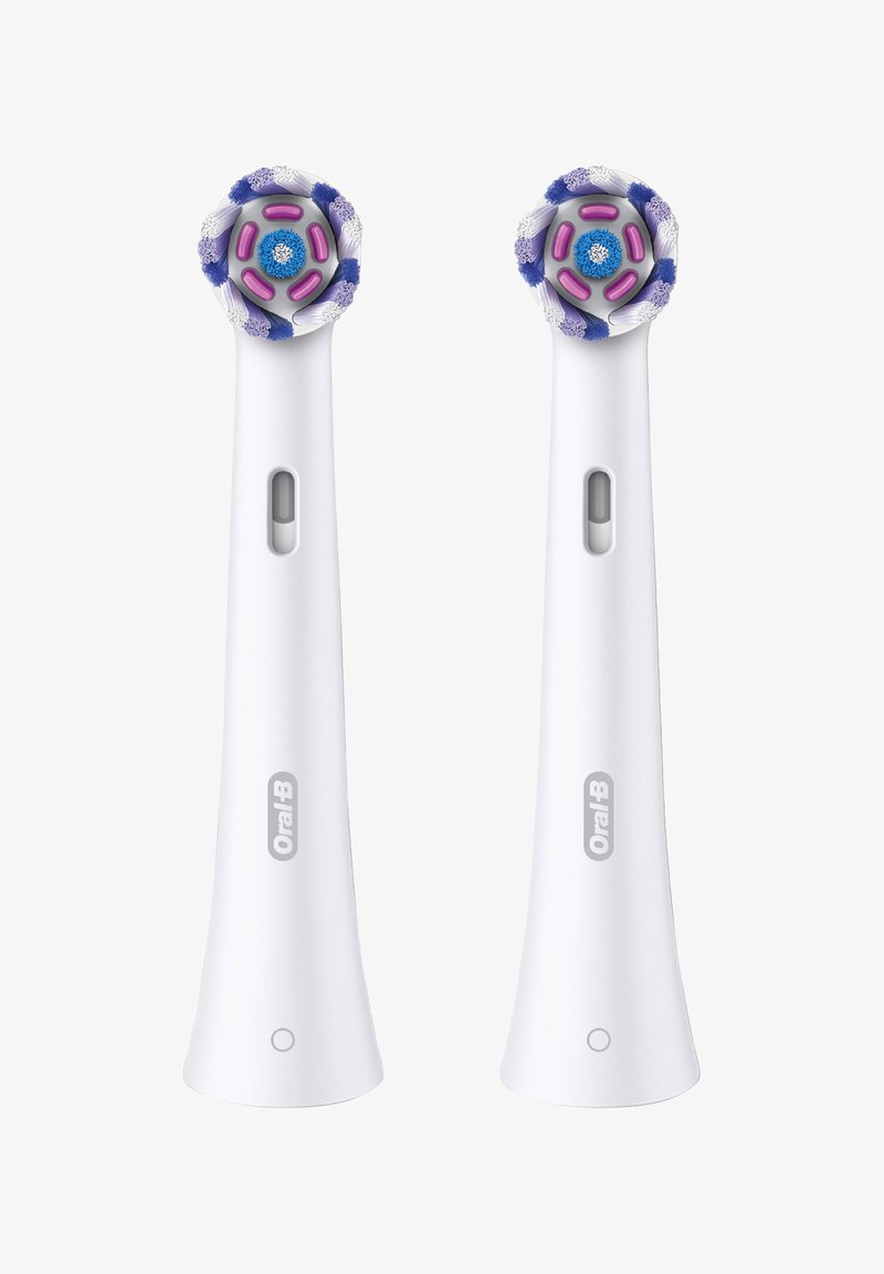 Two Oral-B electric toothbrush heads with circular brush tops, white handles, purple and blue accents, and an indicator window.