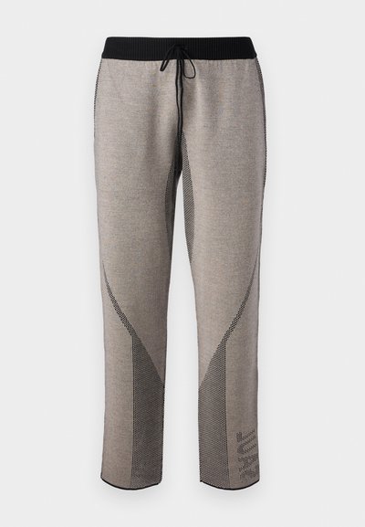 Athletic joggers in a gray fabric with a textured pattern, featuring a black elastic waistband and contrasting side accents.