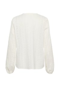 Blusa bianca a maniche lunghe con scollatura rotonda, caratterizzata da strisce verticali testurizzate e polsini arricciati. Tessuto leggero e traspirante.