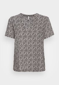 Short-sleeve blouse in light fabric with a V-neck, featuring a black and white floral pattern throughout. Rounded hem, relaxed fit.