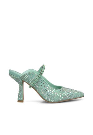 Mint green high-heeled slingback shoe with pointed toe, adorned with cut-out patterns and decorative rhinestones, featuring a thin ankle strap.