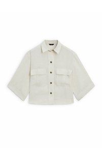 Cropped beige shirt made of linen with a collar, button front, and two chest pockets. Features rolled sleeves and brown buttons.