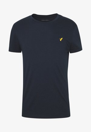 Sötétkék pamut póló kerek nyakkivágással és rövid ujjakkal. A bal mellrészen egy kis sárga hímzett madárlogó található.