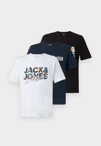 Three cotton T-shirts: one white with colorful logo, one navy with small logo, one black. Short sleeves, round neck, casual fit.