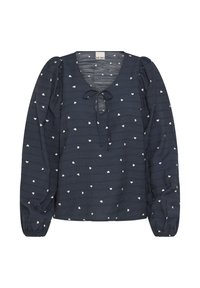 Blusa azul marino con mangas largas y abullonadas, escote en V y un lazo en la parte delantera. Presenta una tela texturizada con pequeños patrones de corazones blancos.
