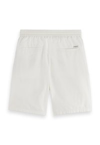 Λευκά βαμβακερά σορτς με ελαστική μέση και δύο πίσω τσέπες. Λείο ύφασμα, ίσια κοπή και ελάχιστη λεπτομέρεια με λογότυπο στο πίσω μέρος.