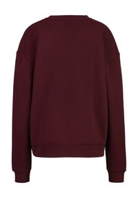 Bordeauxrotes Sweatshirt mit legerer Passform, rundem Ausschnitt, eingesetzten Schulternähten und gerippten Bündchen am Ärmel und Saum. Weicher, strukturierter Stoff.