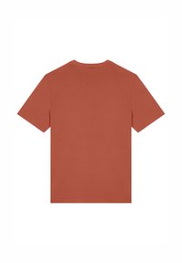 T-shirt en coton couleur rouille avec des manches courtes et un col rond, présentant un dos uni sans embellissements ni motifs.