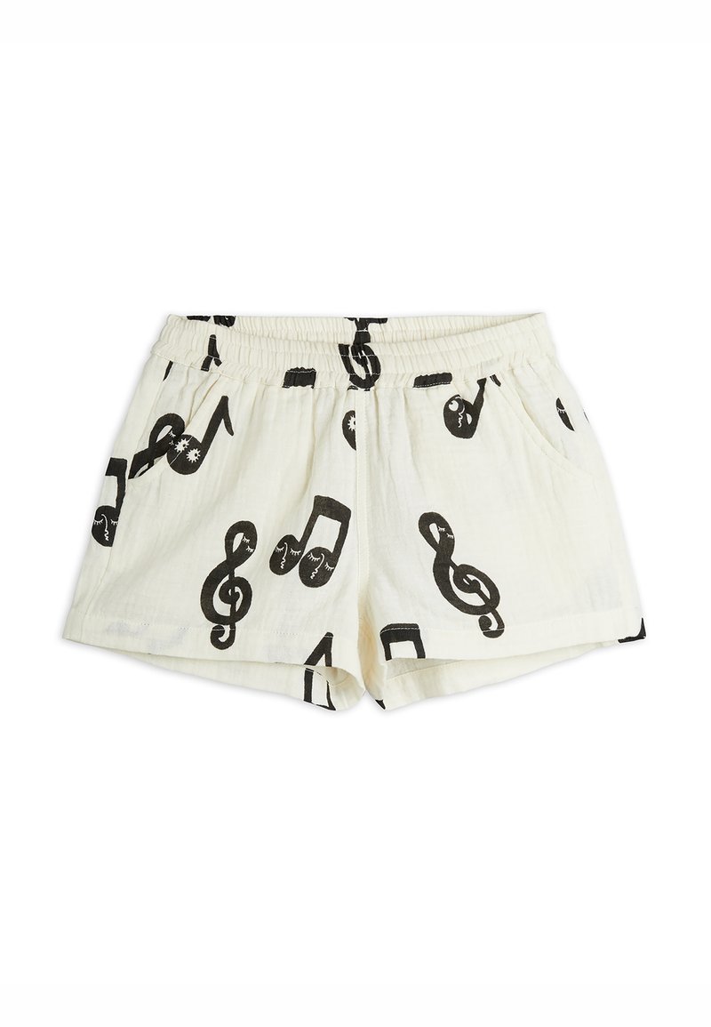 White cotton shorts with a black music note pattern, featuring an elastic waistband and side pockets. Casual design, lightweight texture.