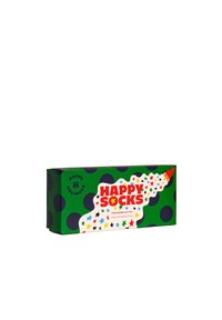 Green gift box with polka dots, featuring a playful design. Label displays "Happy Socks," surrounded by colorful stars. Contains 3 pairs of kids' socks.