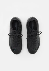 Black athletic shoes with a textured surface, featuring matching black laces, sleek design, and a subtle teal accent on the sides.