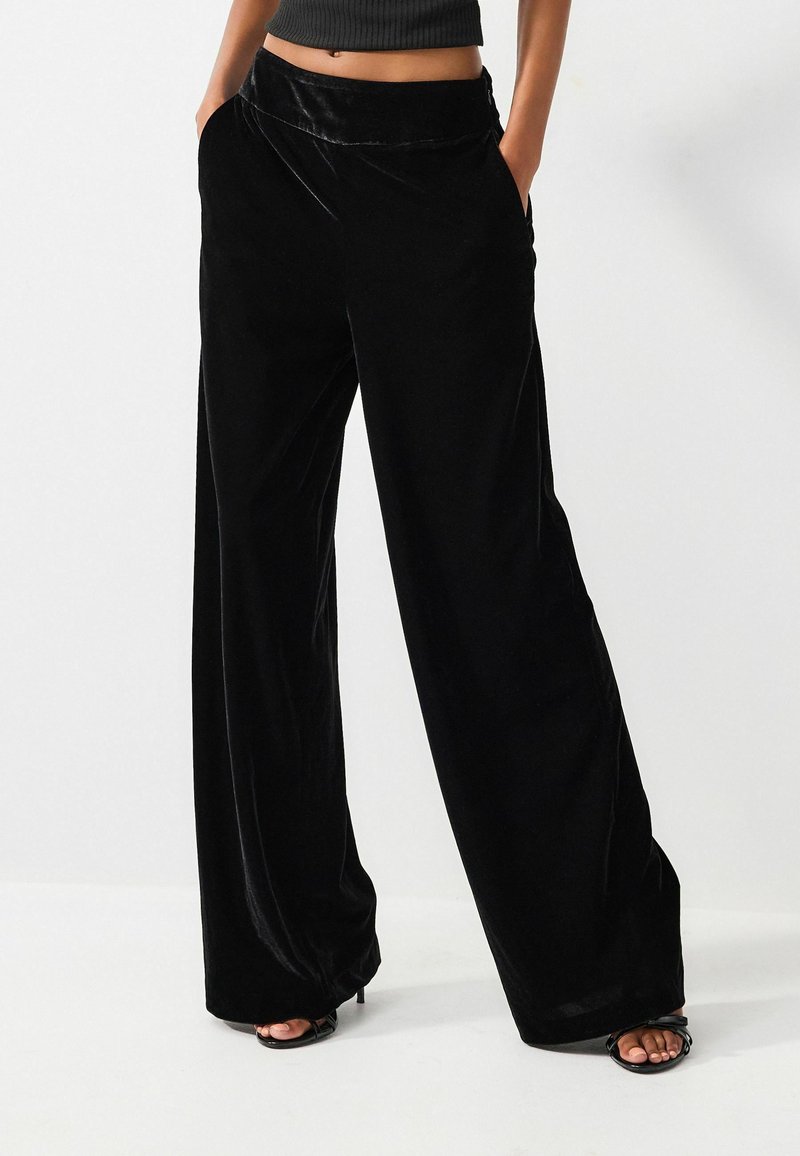 Pantalon magique ajusté noir femme | Bréal