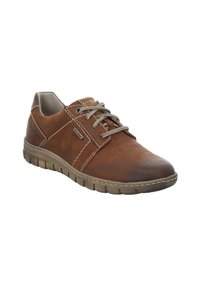 Brown leather shoe with gray laces, round toe, and textured surface. Features stitched accents and flexible rubber sole with grooves.