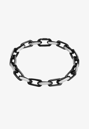 Metalinė grandinėlė su pakaitiniais juodais ir sidabriniais žiedais. Dizainas apima pailgas stačiakampio formas su lygiu paviršiumi.