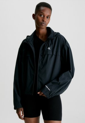 HOODED WINDBREAKER - Chaqueta fina - ck black