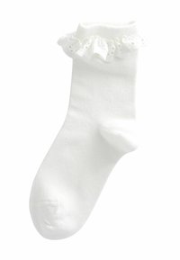 Calza bianca in cotone con un polsino in pizzo arricciato, texture liscia e punta arrotondata senza motivi o dettagli prominenti.