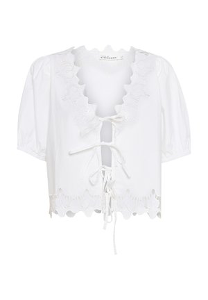 Fehér, crop fazonú pamut blúz, díszes nyakkivágással, puffos ujjakkal és megkötős záródással. Az éleket virágmintájú hímzés ékesíti.