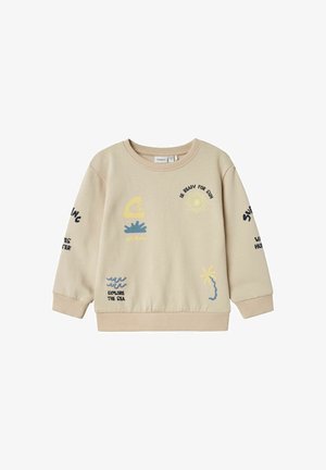 Beigefarbener Kinderpullover mit Sonne- und Meer-Motiven, einschließlich "Be ready for sun," "Explore the sea," und abstrakten Sonnen- und Wellen-Designs.