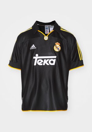 Schwarzes Fußballtrikot aus atmungsaktivem Material. Mit gelben Akzenten, einem gestickten Emblem und dem Sponsorlogo in Weiß. Klassisches Kragen-Design.