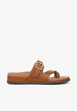Brown leather slide sandal with a textured finish, an adjustable strap and gold buckle detail. Soft footbed for comfort. Flat rubber sole.