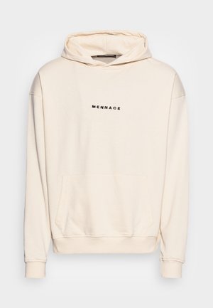 Sweat à capuche couleur crème avec poche avant et texte noir "MENNACE" centré sur la poitrine, présenté sur un fond uni.