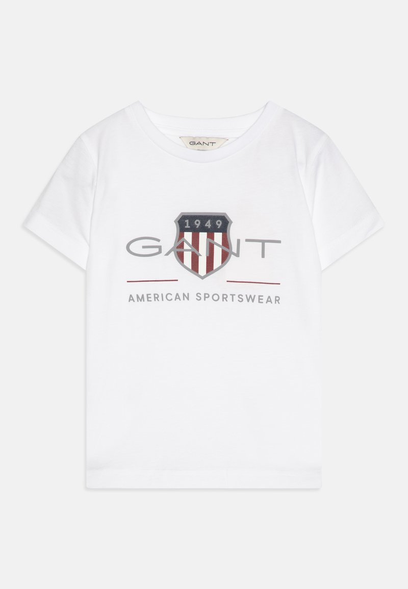 White cotton t-shirt featuring a central graphic with a shield design, "GANT" logo, and "1949" in red, navy, and gray colors. Short sleeves.