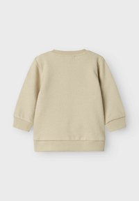 Beige katoenen sweatshirt met een geribbelde ronde hals, lange mouwen en een rechte zoom. Gelaagd weefsel met een subtiel gebreid patroon.