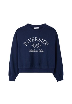 Felpa corta blu navy con testo bianco "Riverside 1987 California State" e disegno di corona d'alloro sul davanti. Maniche lunghe e polsini a coste.