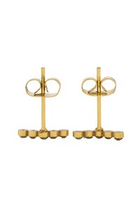 Kolczyki wkrętki z metalu w kolorze złota o unikalnym kształcie knykci; posiadają zaokrąglone akcenty i gładkie, polerowane wykończenie.