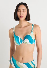 Bikini rinkinys su mėlynų, žalių ir baltų banguotų juostelių mišiniu. Savybės: reguliuojamos petnešos su mazgų akcentais ir paminkštinta viršutinė dalis.