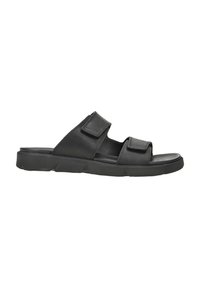 Sandale noire dotée de deux lanières réglables en Velcro, d'une semelle intérieure rembourrée et d'une semelle en caoutchouc texturé avec un motif de traction.