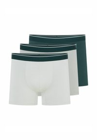 Trzy pary bokserek w kolorze białym i ciemnozielonym. Miękka bawełniana tkanina o gładkiej teksturze. Szeroki elastyczny pas w ciemnozielonym kolorze w paski.