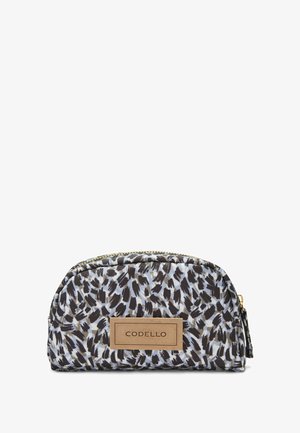 Kleine cosmetica-tas in een gestreept stof met zwarte en beige abstracte vlekken op een lichtblauwe achtergrond. Heeft een gouden rits en een leren label.