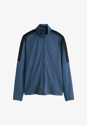 Blå zip-up-jacka med svarta axelpaneler; tillverkad av slät, lättviktig tyg; har hög krage och långa ärmar.