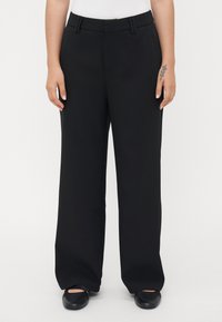 Black wide-leg trousers with a smooth texture, featuring a waistband with belt loops and slant pockets on each side.