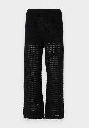 Black knit pants featuring a textured, open mesh design with wide legs. The waistband is elasticated for comfort and ease of wear.