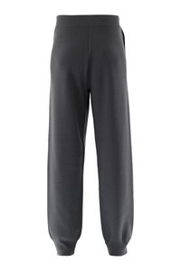 Graue Jogginghose mit lockerem Schnitt, elastischem Bund und engen Bündchen. Hergestellt aus weichem Stoff ohne sichtbare Muster oder Verzierungen.