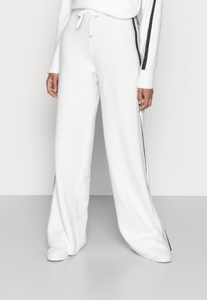 Tommy Hilfiger FLEX WIDE LEG PANT - Tracksuit bottoms - ecru