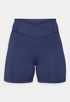 Mørkeblå aktive shorts med høy livlinje, med et kryssdesign på toppen. Laget av elastisk, glatt stoff.