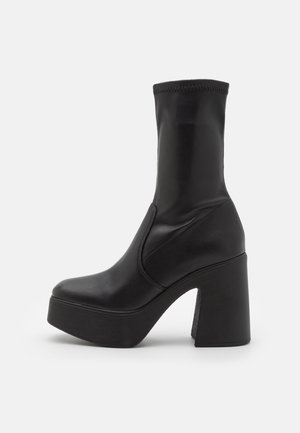 LOW PHOENIX - Bottines à talons hauts - black