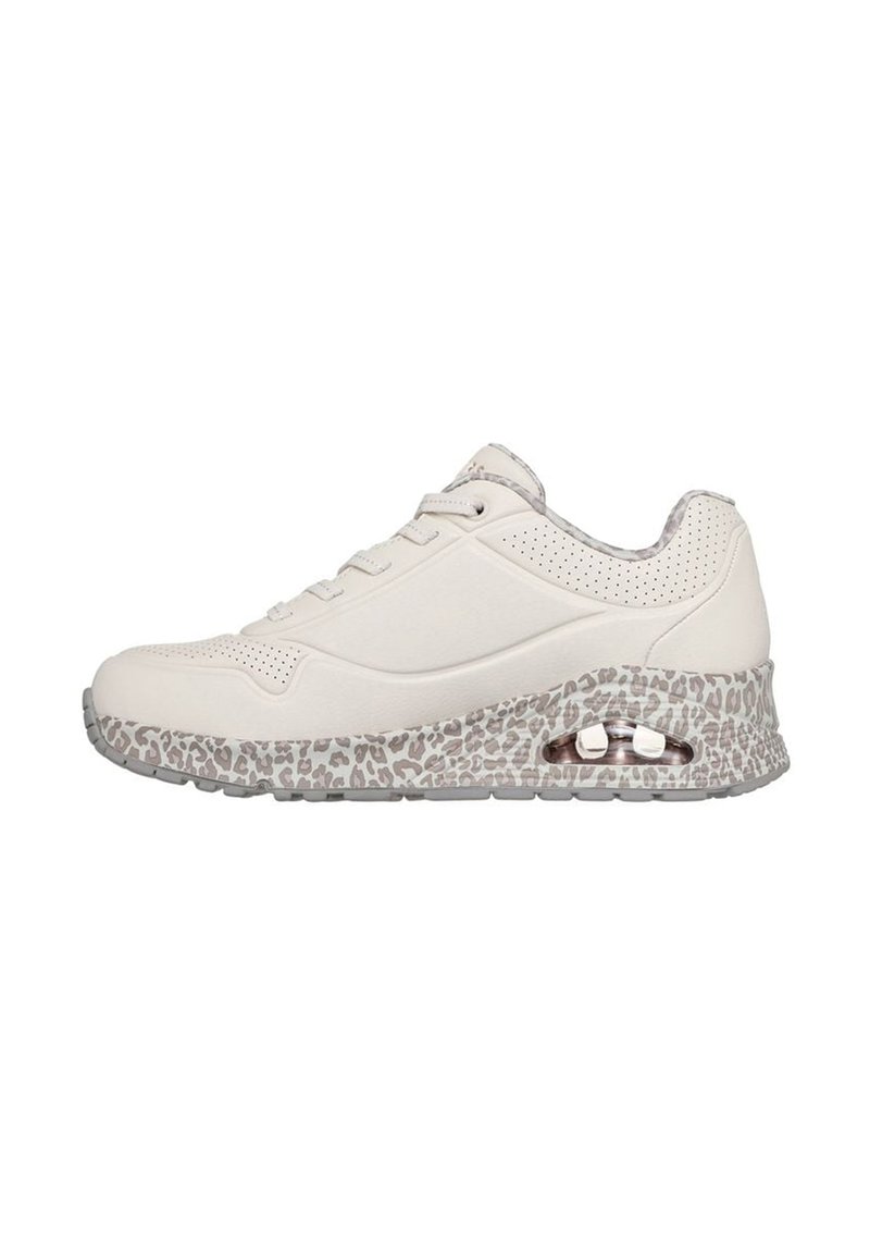 White sneaker with a textured beige leopard print midsole, lace-up front, and perforated detailing on the sides. Clear cushioning visible in heel.