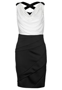 Svart och vit ärmlös klänning med en draperad vit topp, figurnära svart kjol med diagonala veck och korsade band.
