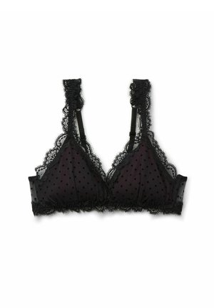 Bralette en dentelle noire avec un motif à pois. Doté de bonnets en forme de triangle, de bords en forme de vagues et de bretelles décoratives. Matériau doux et transparent.