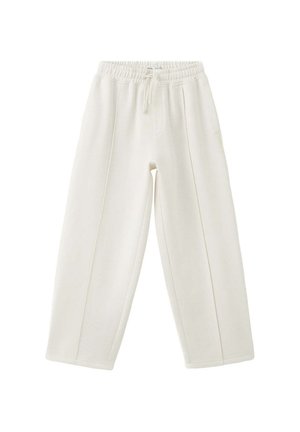 Witte loszittende joggingbroek met elastische tailleband en trekkoord, met verticale naaddetails aan de voorkant en een ontspannen taps toelopend ontwerp van de pijp.