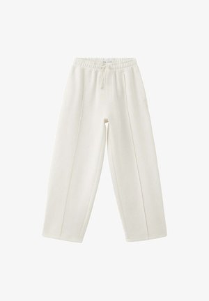 Witte loszittende joggingbroek met elastische tailleband en trekkoord, met verticale naaddetails aan de voorkant en een ontspannen taps toelopend ontwerp van de pijp.