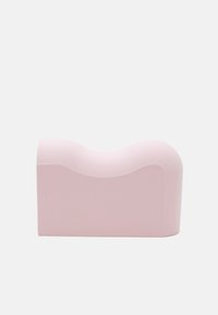 Pink foam block with a wavy top, rectangular base, smooth texture, and rounded corners, designed for versatile use as a decorative or functional object.