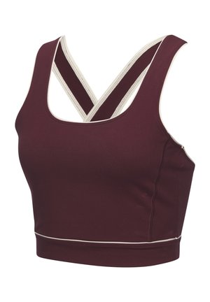 Maroon sports crop top with a scoop neckline, featuring crossed straps and white trim. Made from stretchy, smooth fabric for comfort.